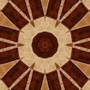 棕色色调的复杂万花筒图案，呈现在纹理般的织物状背景上