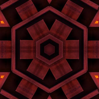 这是一幅充满活力的几何抽象艺术作品，以温暖的色调呈现六边形万花筒图案