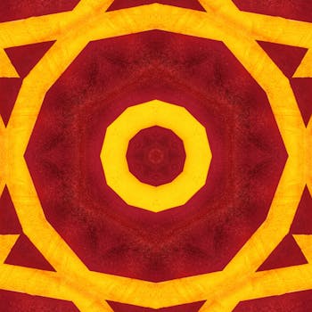 这幅抽象万花筒图案明亮而富有动感，呈现出暖红色与黄色的色调