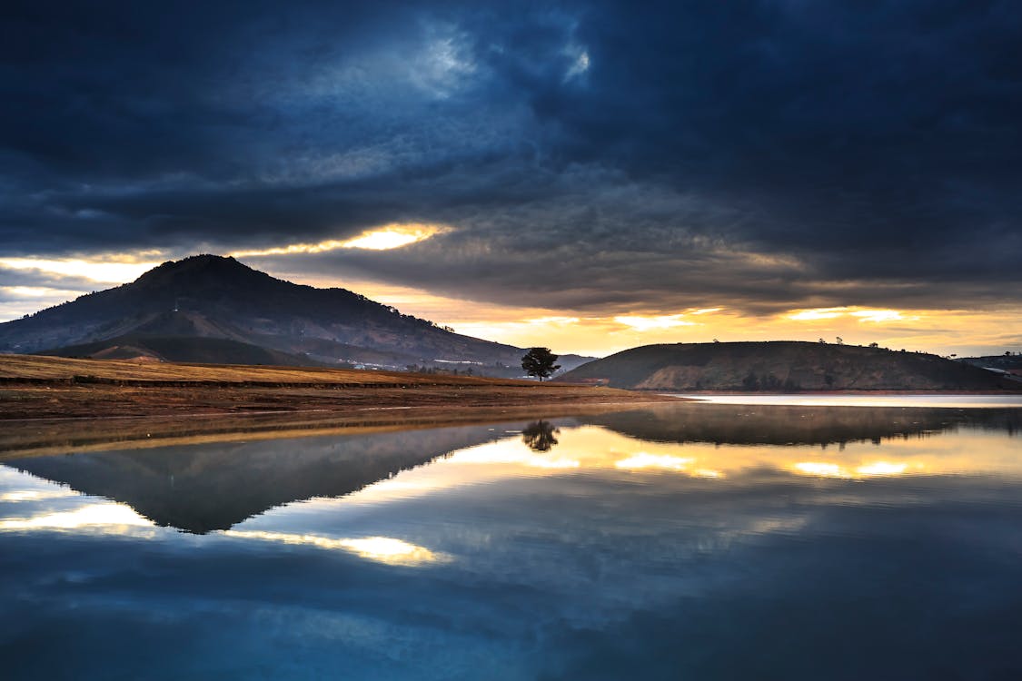 Mountain Reflection on Body of Water