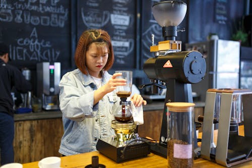Free Woman Making Coffee Stock Photo