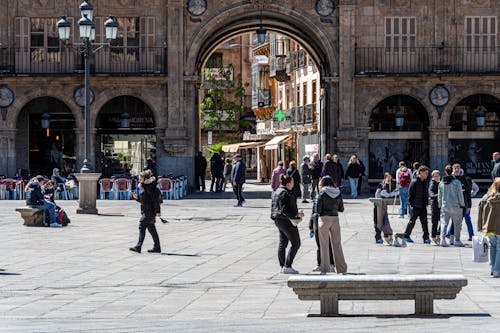 A group of people standing in a plaza