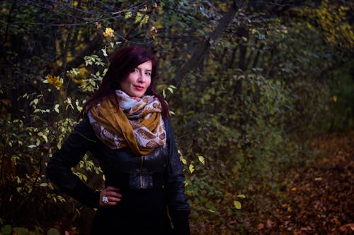 Woman in Black Leather Jacket Beside Trees