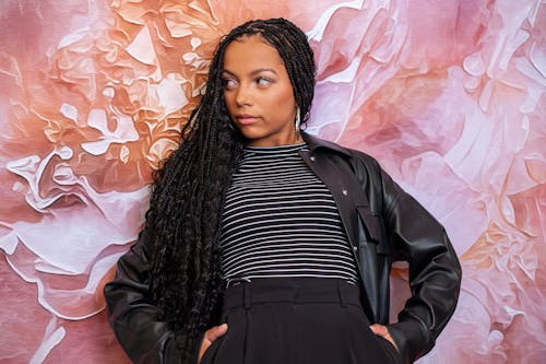 Free Long-Haired Model Wearing a Black Leather Jacket Stock Photo