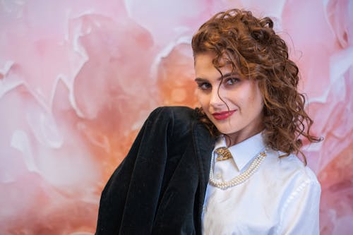 Free Portrait of a Female Model Wearing a Black Coat and a White Shirt Stock Photo