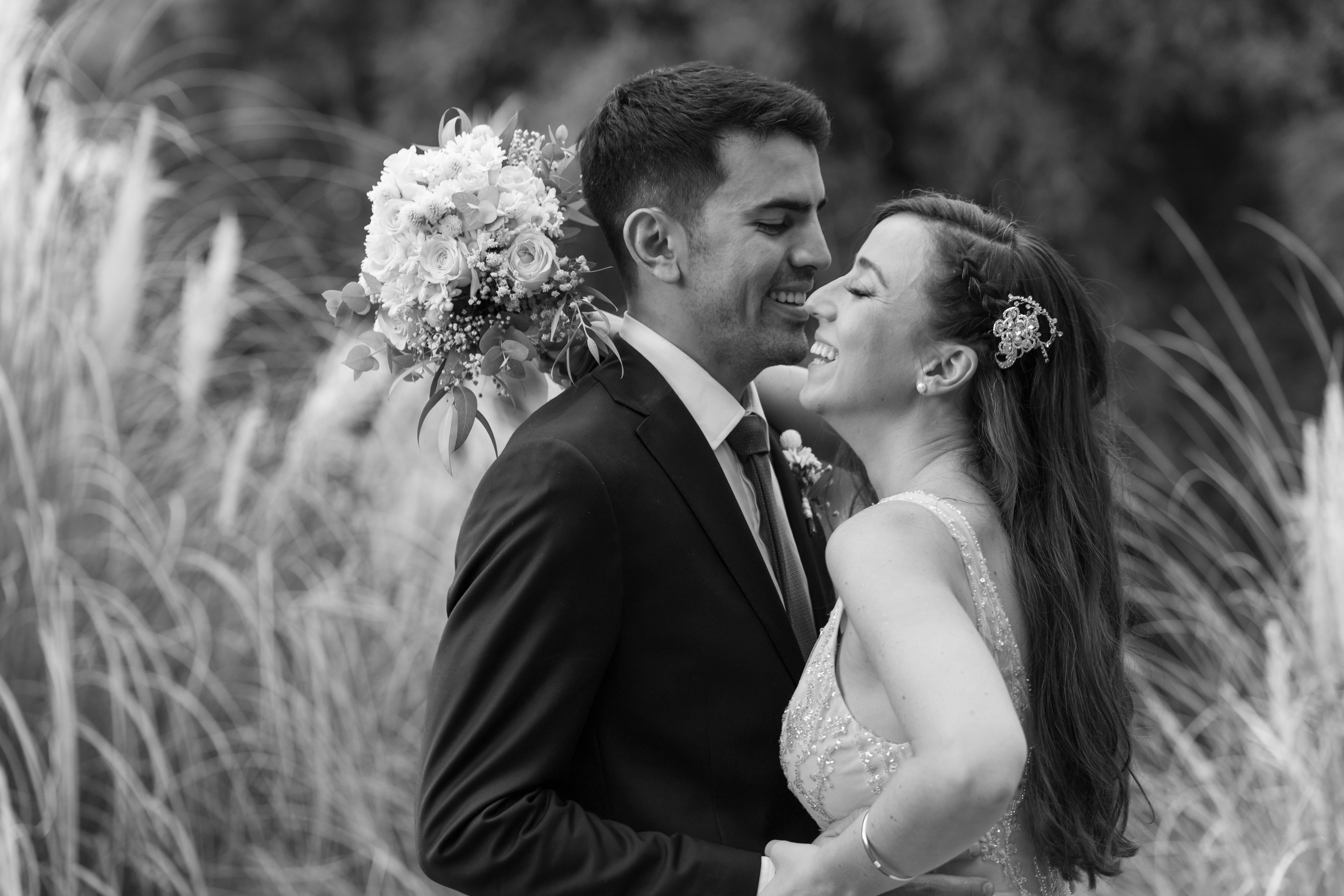Smiling Newlyweds Standing Together in Black and White · Free Stock Photo