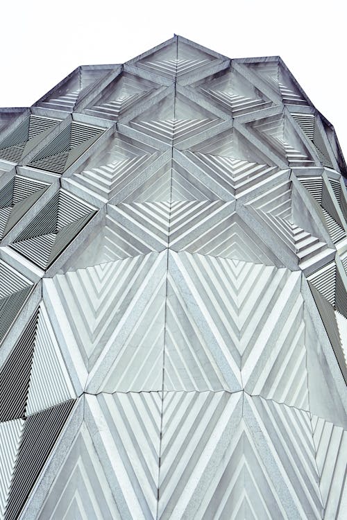 A close up of a building with geometric shapes
