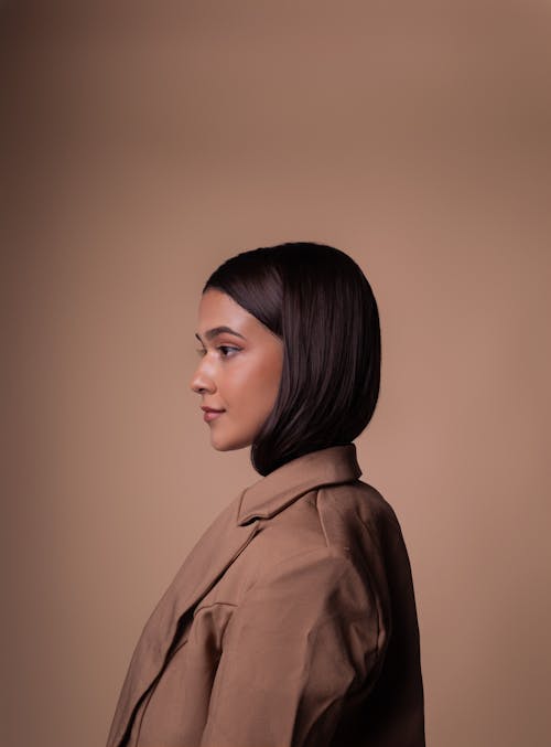 Portrait of Woman in Brown Background