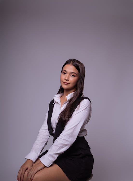 Portrait of Woman in Shirt and Overalls