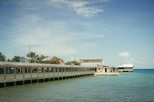 A pier with a building on it and a boat