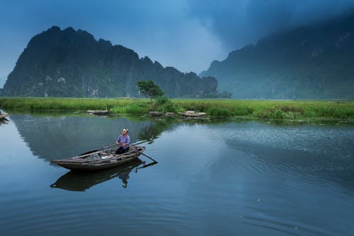 Free Person Riding Boat  Stock Photo