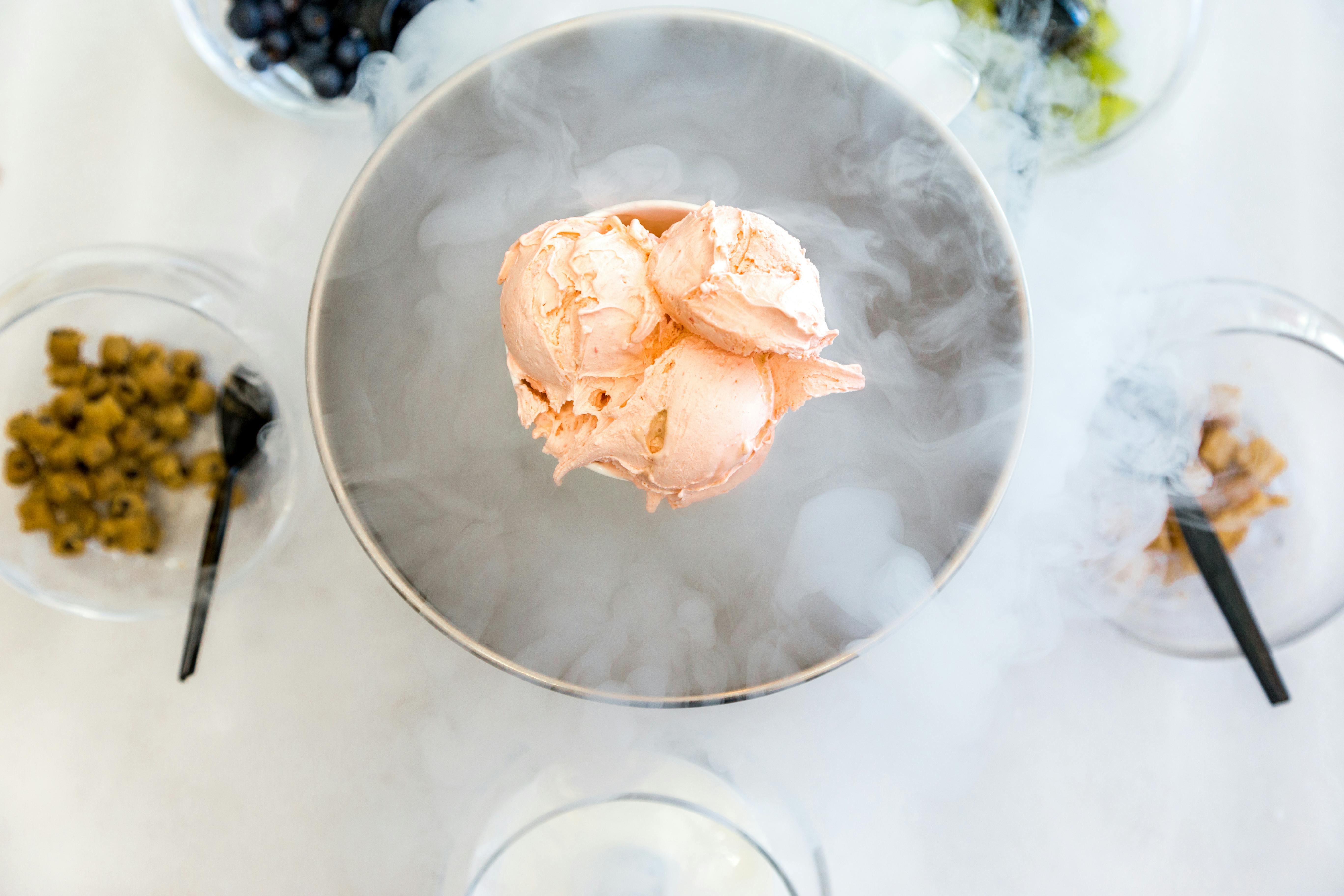 A classic banana split with all the toppings in a glass dish.