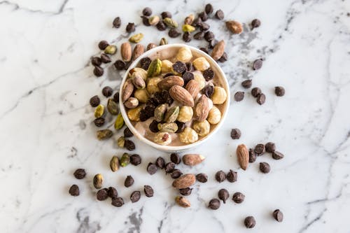 Free Nuts in Round White Bowl Stock Photo