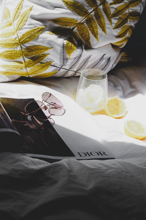 Free A magazine on a bed with lemon slices Stock Photo