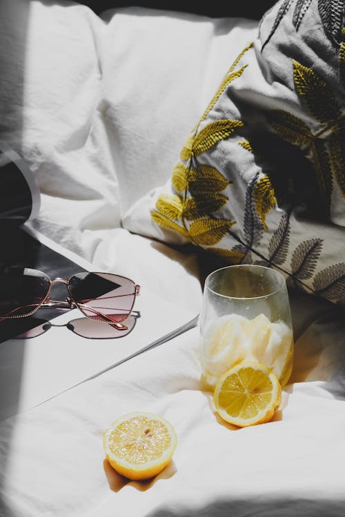 Free A bed with a lemon and sunglasses on it Stock Photo