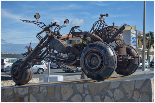 Free stock photo of monumental sculpture, motorbike, praia de faro portugal