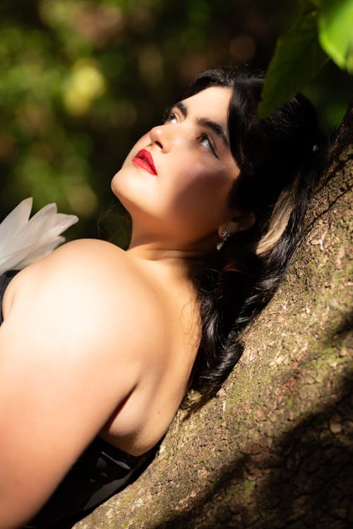 Woman Posing on a Trunk