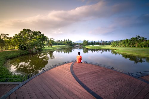 Free Person Sitting on Dock Stock Photo