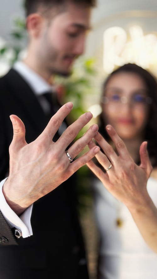 Free A man and woman holding their hands together Stock Photo