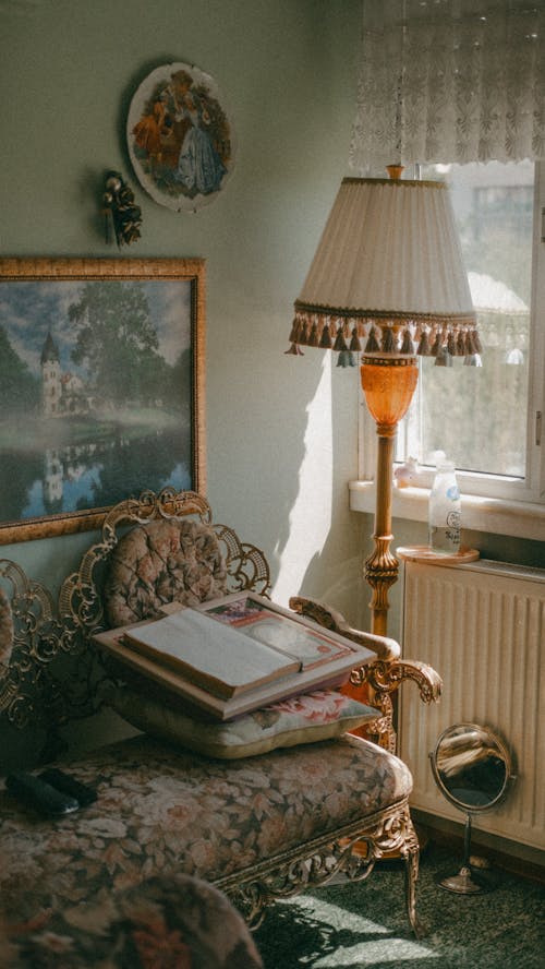 Free A lamp sits on a table next to a couch Stock Photo