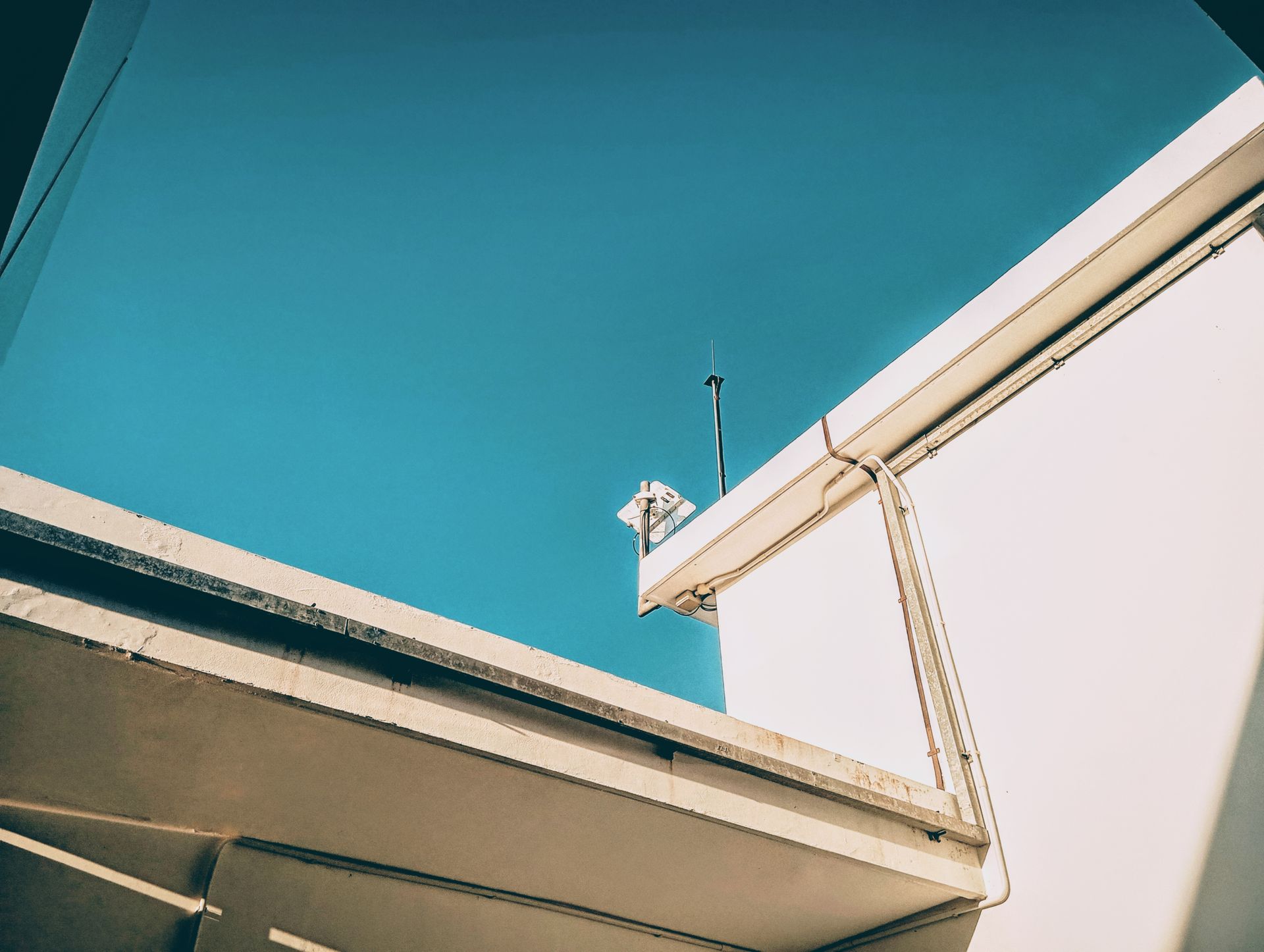 Antenna on a Roof in Sunlight