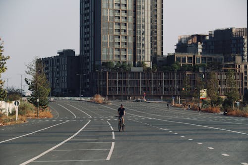 A person riding a bike on an empty street