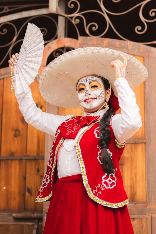 Free A woman in mexican costume holding a fan Stock Photo