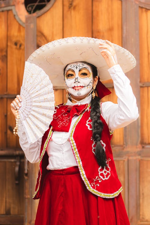 Free A woman in mexican costume holding a fan Stock Photo