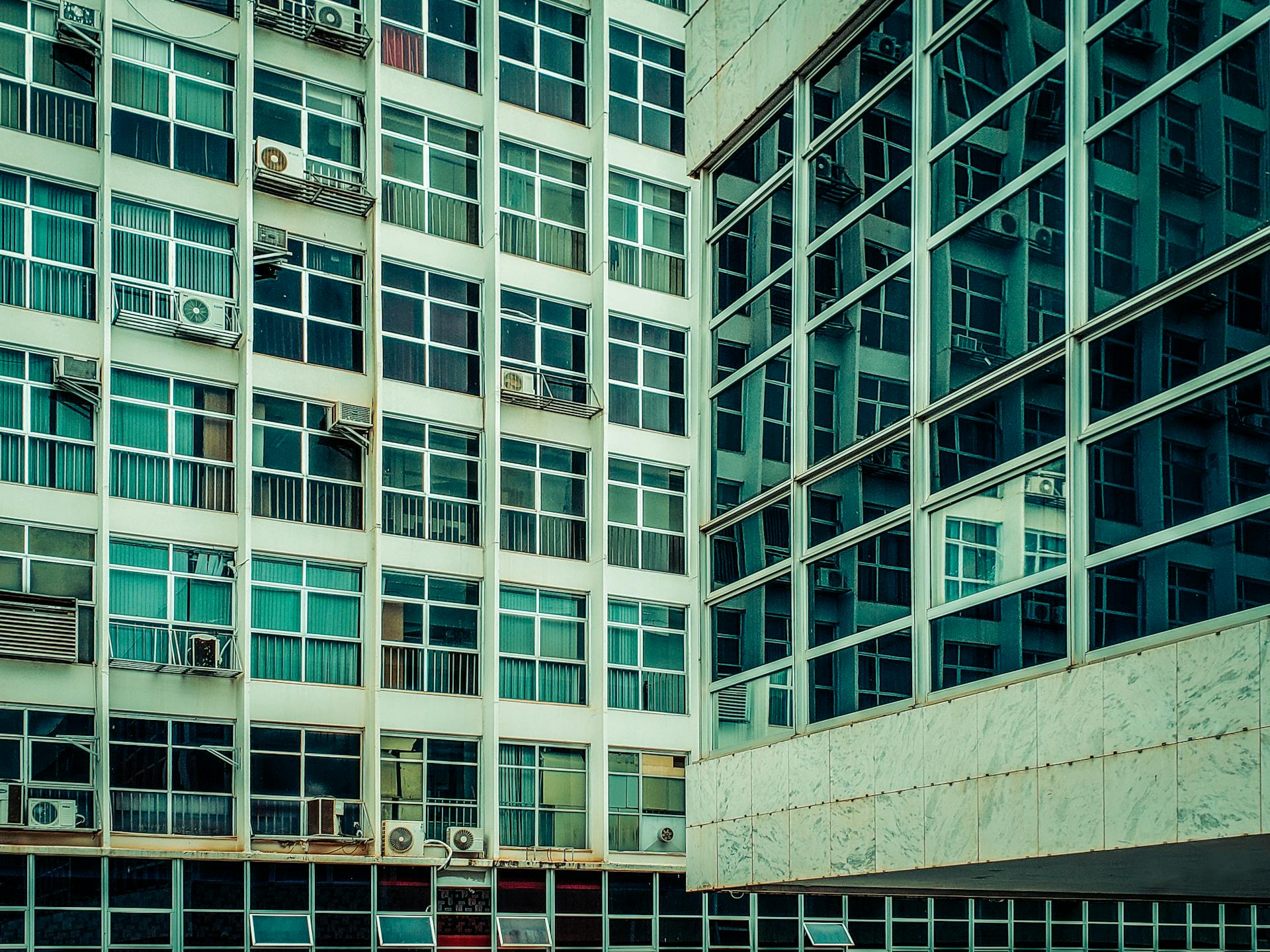 AC Units on Windows of Old Glass Building