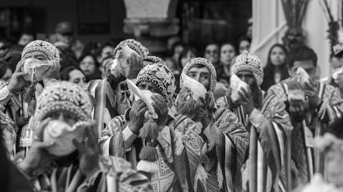 A black and white photo of people in costumes