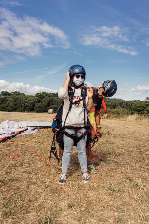 Free A couple preparing for paragliding in Pénestin, Bretagne, France. Stock Photo