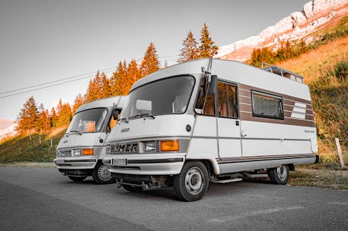 Free Two rv's parked in front of a mountain Stock Photo