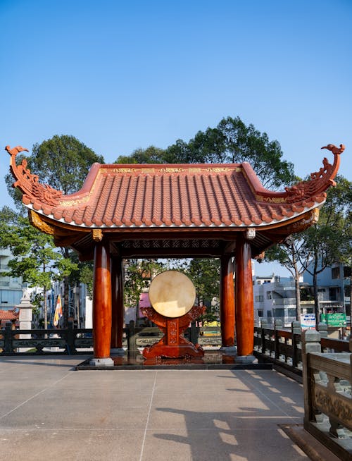 A chinese pagoda with a gong on top