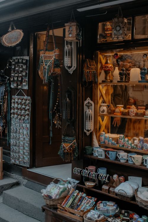 Free Explore a charming souvenir shop displaying ceramic items and local crafts on a city street. Stock Photo