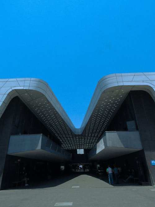 The entrance to a building with a curved roof