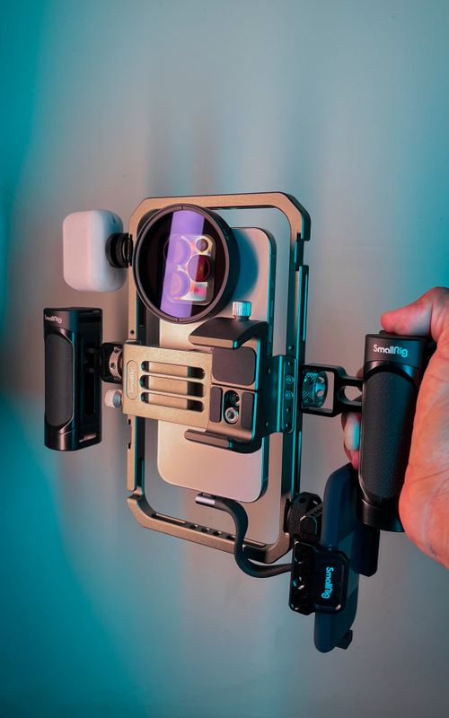 Free Close-up of a professional video rig with smartphone and accessories, perfect for cinematic filming. Stock Photo