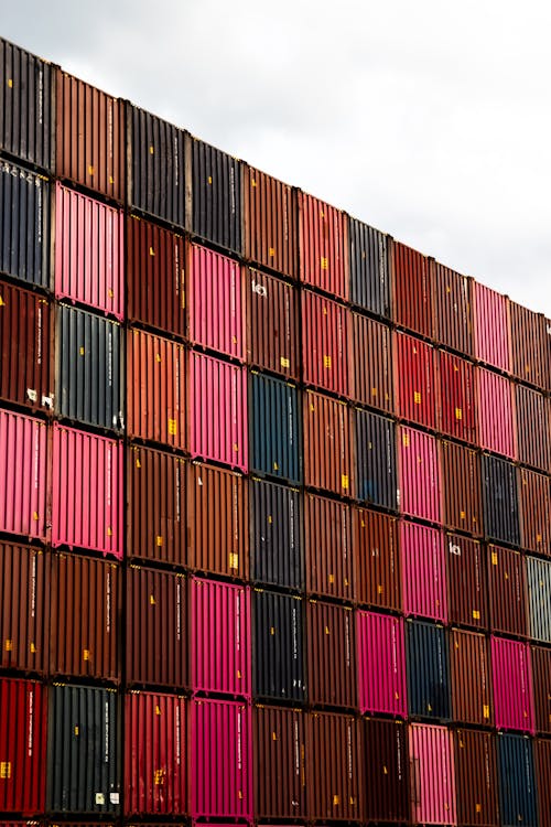 A large stack of shipping containers with different colors