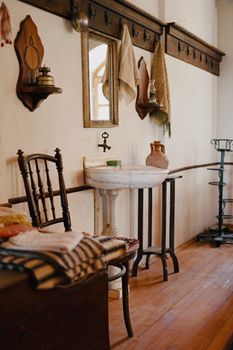 A warm and inviting vintage-style bathroom featuring wooden decor and classic fixtures.