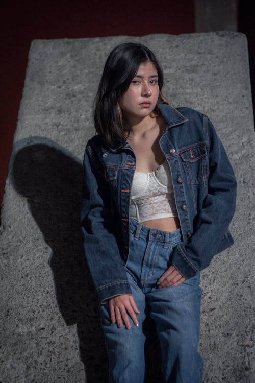 Free Young Beautiful Woman in Denim Jacket and Jeans Stock Photo