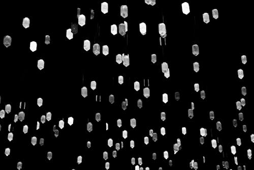 A black and white photo of a bunch of white lights