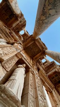 A stunning low-angle shot capturing the ancient Library of Celsus in Ephesus, Turkey.