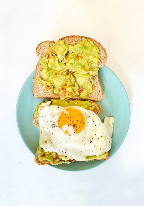 Free An egg and avocado sandwich on a plate Stock Photo