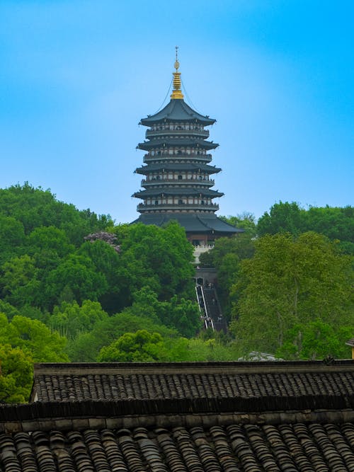 Free A pagoda on top of a hill with trees Stock Photo