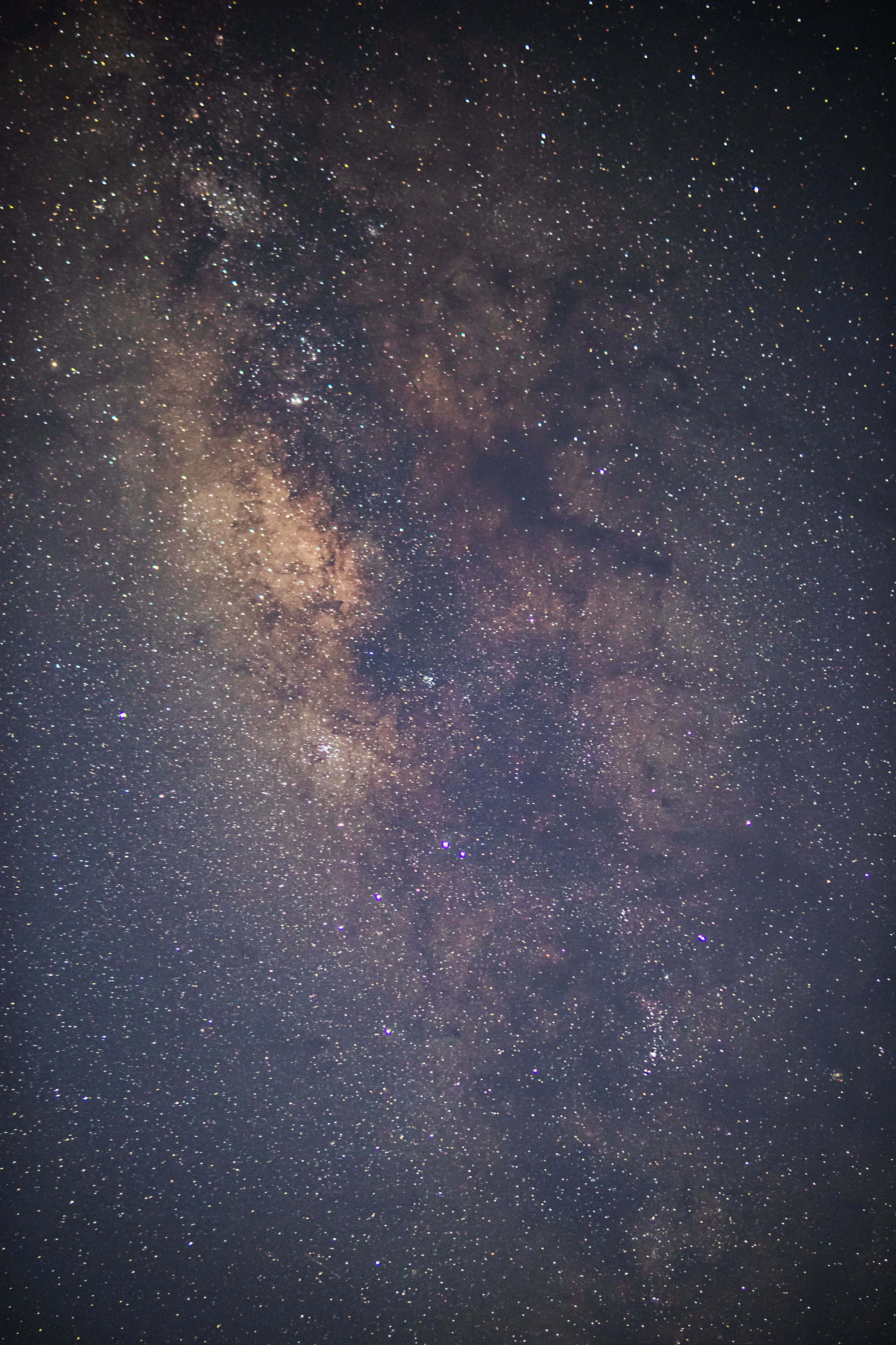 Stunning vertical capture of the Milky Way, showcasing cosmic wonders and twinkling stars.