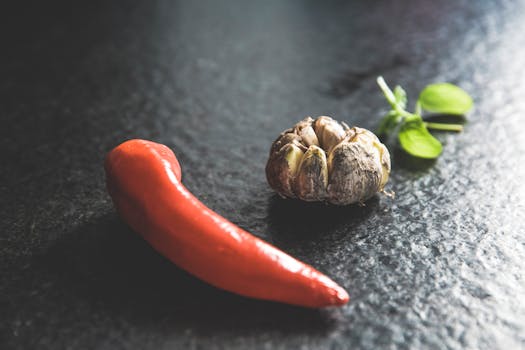 Red Chili Beside Brown Bead and Green Leaf