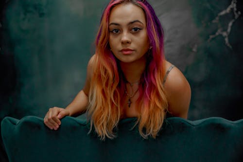 A woman with pink hair and purple streaks