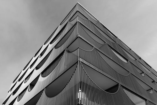 Black and white photo of a modern building facade showcasing futuristic design in Jönköping, Sweden.