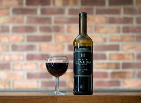 Selective Focus of Wine in Glass and Bottle 