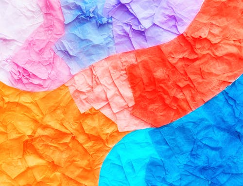 Crumpled paper background with colorful colors