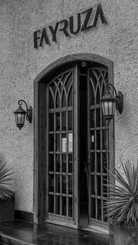 Stylish black and white photo of an arched entrance in Jazan, Saudi Arabia.